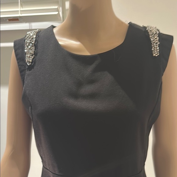 Black Sleeveless Peplum Blouse with Embellished Shoulders - Picture 4 of 7